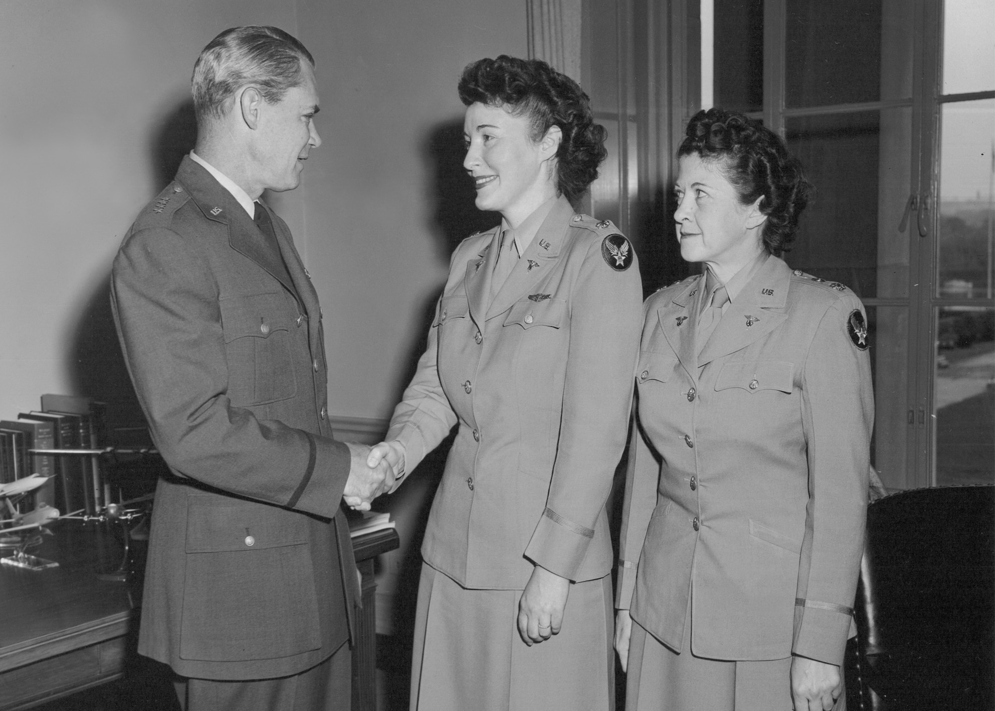 General Hoyt S. Vandenberg, Chief of Staff, U.S. Air Force, congratulates chief of the Air Force Nurse Corps, Lt. Col. Verena Zeller (center), and chief of the Air Force Women’s Medical Specialists, Lt. Col. Miriam Perry (right), upon their promotion. (Courtesy photo)