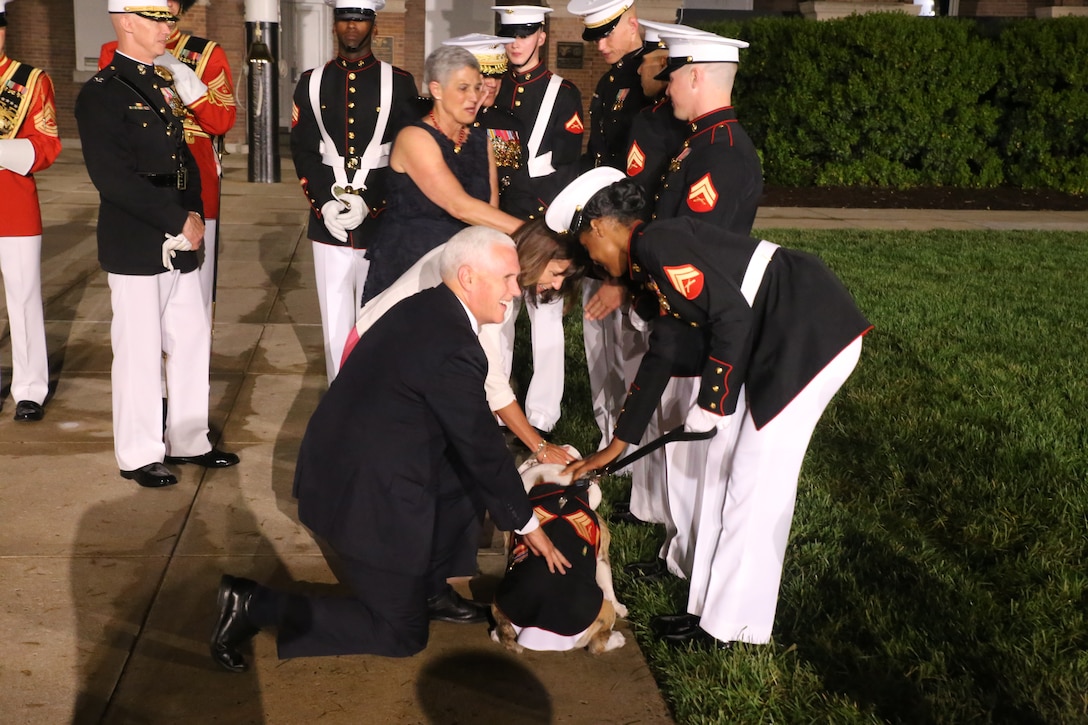U.S. Vice President Mike Pence and Second Lady Karen Pence pet Chesty XIV following the Friday Evening Parade at Marine Barracks Washington D.C.