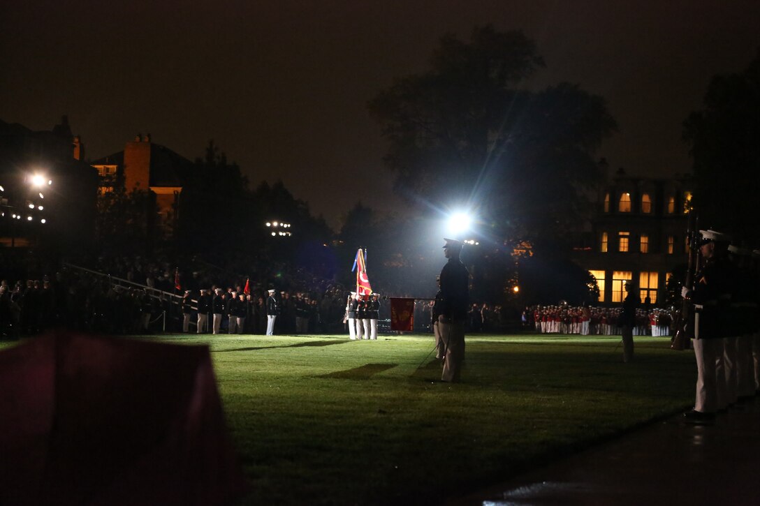 Marines present arms during the Friday Evening Parade at Marine Barracks Washington D.C., May 4, 2018. The Friday Evening Parade was the first of the 2018 season. U.S. Vice President Mike Pence was the guest of honor, and the parade was hosted by Commandant of the Marine Corps Gen. Robert B. Neller. (U.S. Marine Corps photo by Cpl. Damon Mclean/Released)