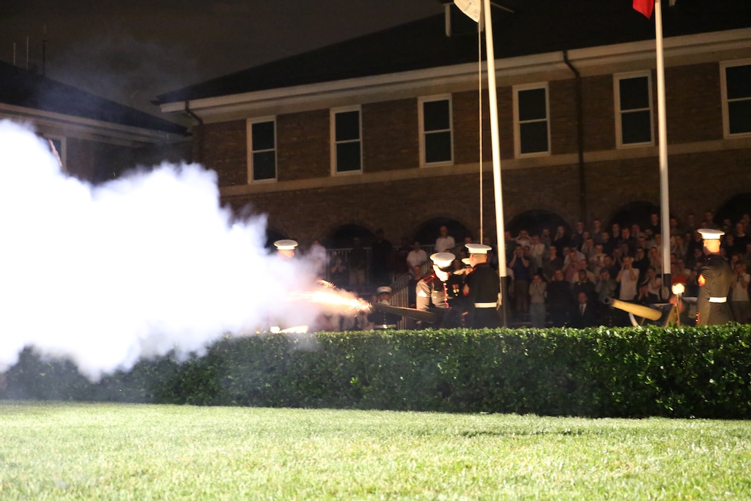 Marines fire a cannon volley while rending honors to U.S. Vice President Mike Pence the guest of honor for the Friday Evening Parade at Marine Barracks Washington D.C., May 4, 2018. The Friday Evening Parade was the first of the 2018 season. The vice president was the guest of honor, and the parade was hosted by Commandant of the Marine Corps Gen. Robert B. Neller. (U.S. Marine Corps photo by Cpl. Damon Mclean/Released)