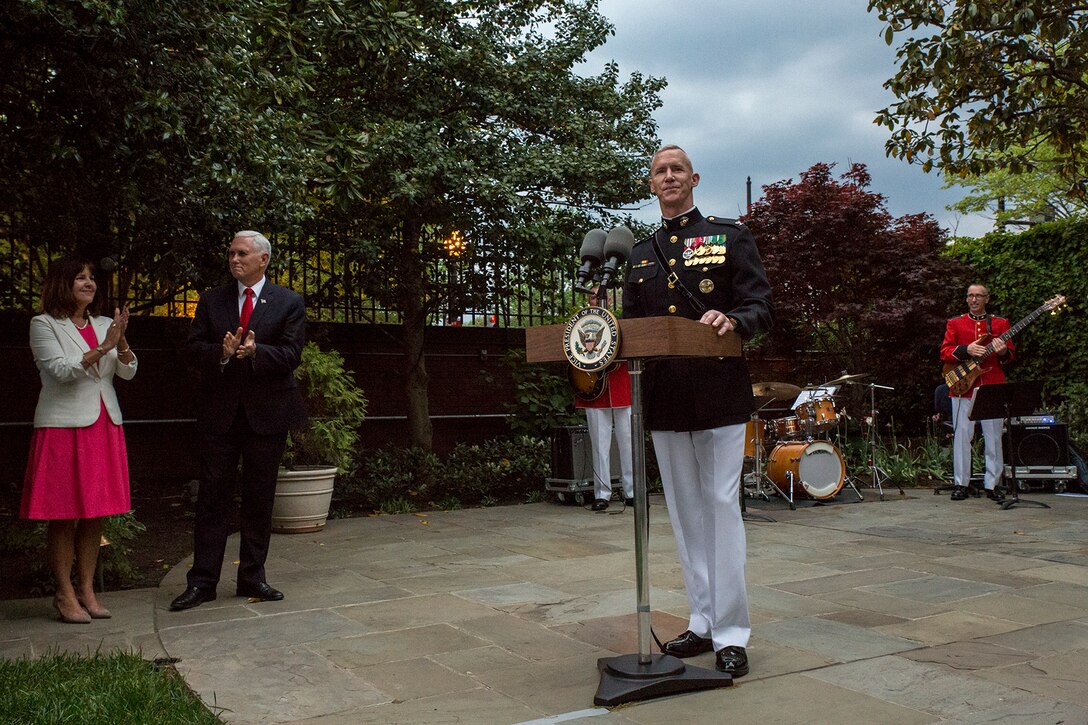 U.S. Vice President Mike Pence and Second Lady Karen Pence applaud as Col. Tyler J. Zagurski, commanding officer of Marine Barracks Washington D.C., welcomes guests to the Marine and Family Garden during a pre-parade reception, May 4, 2018. The Friday Evening Parade was the first of the 2018 season. The vice president was the guest of honor, and the parade was hosted by Commandant of the Marine Corps Gen. Robert B. Neller. (U.S. Marine Corps photo by Sgt. Robert Knapp/Released)