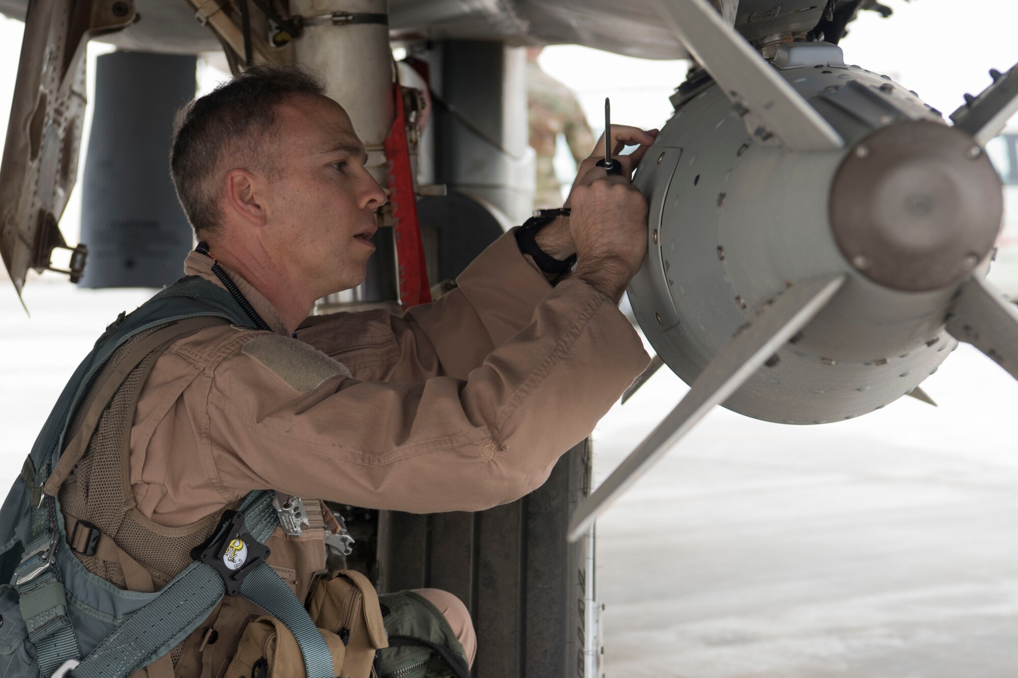 Col. Shane Steinke, 332nd Air Expeditionary Wing vice commander, performs pre-checks prior to flying May 7, 2018, at an undisclosed location in Southwest Asia.