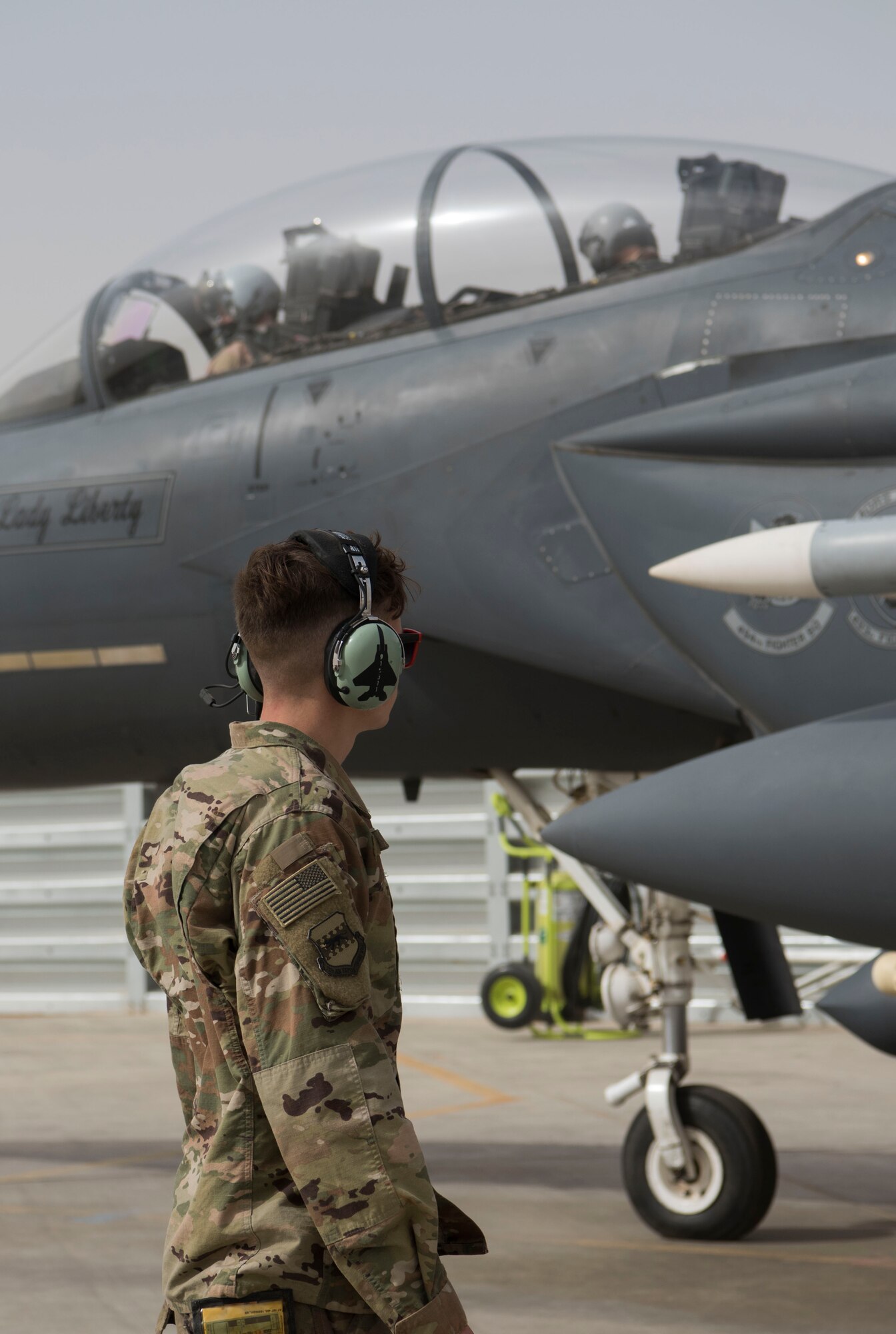 An Airman with the 332nd Expeditionary Maintenance Squadron performs pre-checks as Col. Shane Steinke, 332nd Air Expeditionary Wing vice commander, prepares to complete his final flight May 7, 2018, at an undisclosed location in Southwest Asia.