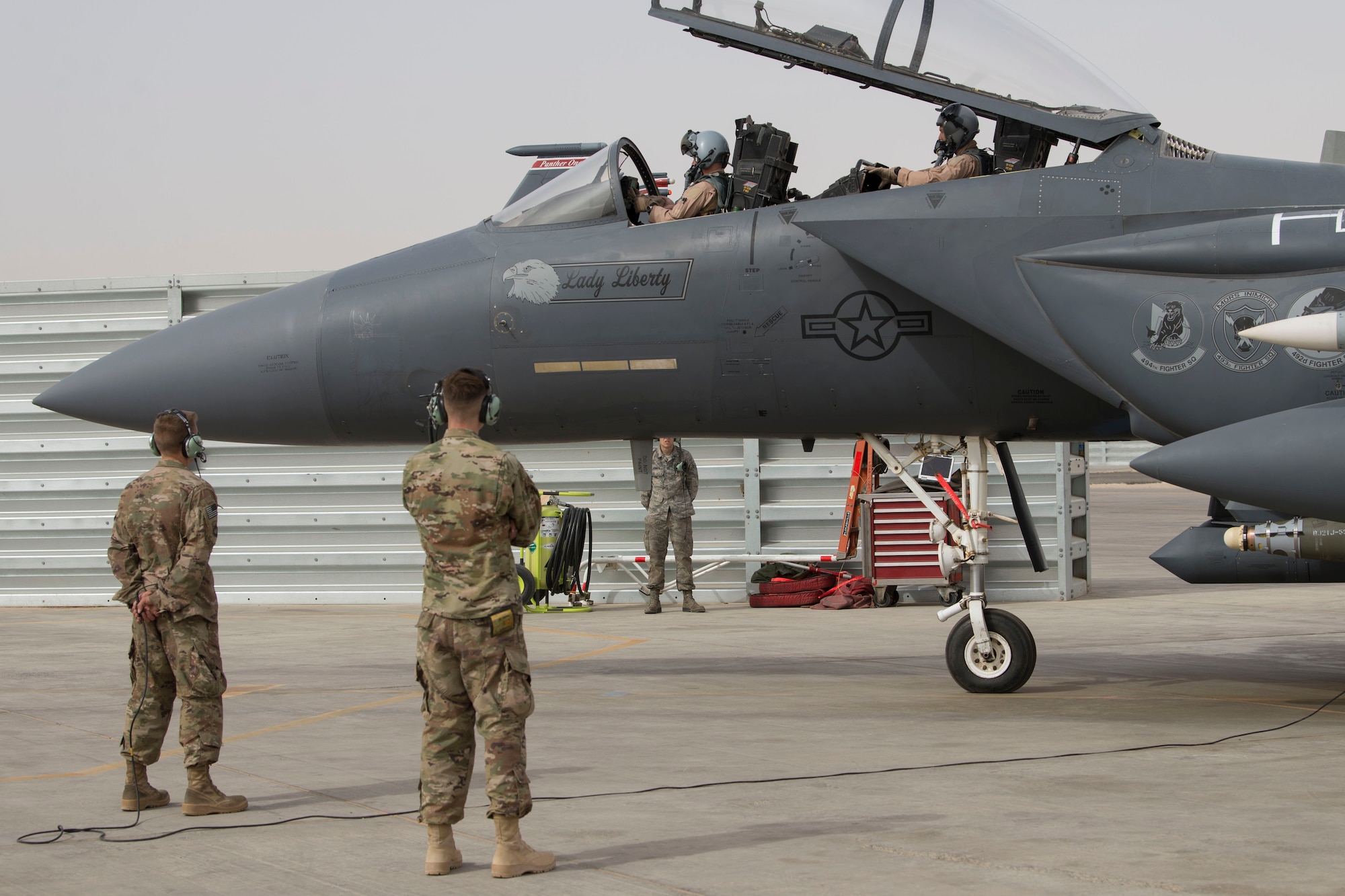 Airmen with the 332nd Expeditionary Maintenance Squadron performs pre-checks as Col. Shane Steinke, 332nd Air Expeditionary Wing vice commander, prepares to complete his final flight May 7, 2018, at an undisclosed location in Southwest Asia.