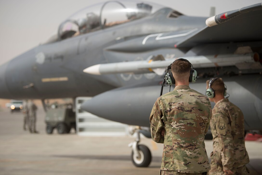 Airmen with the 332nd Expeditionary Maintenance Squadron perform pre-checks as Col. Shane Steinke, 332nd Air Expeditionary Wing vice commander, prepares to complete his final flight May 7, 2018, at an undisclosed location in Southwest Asia.