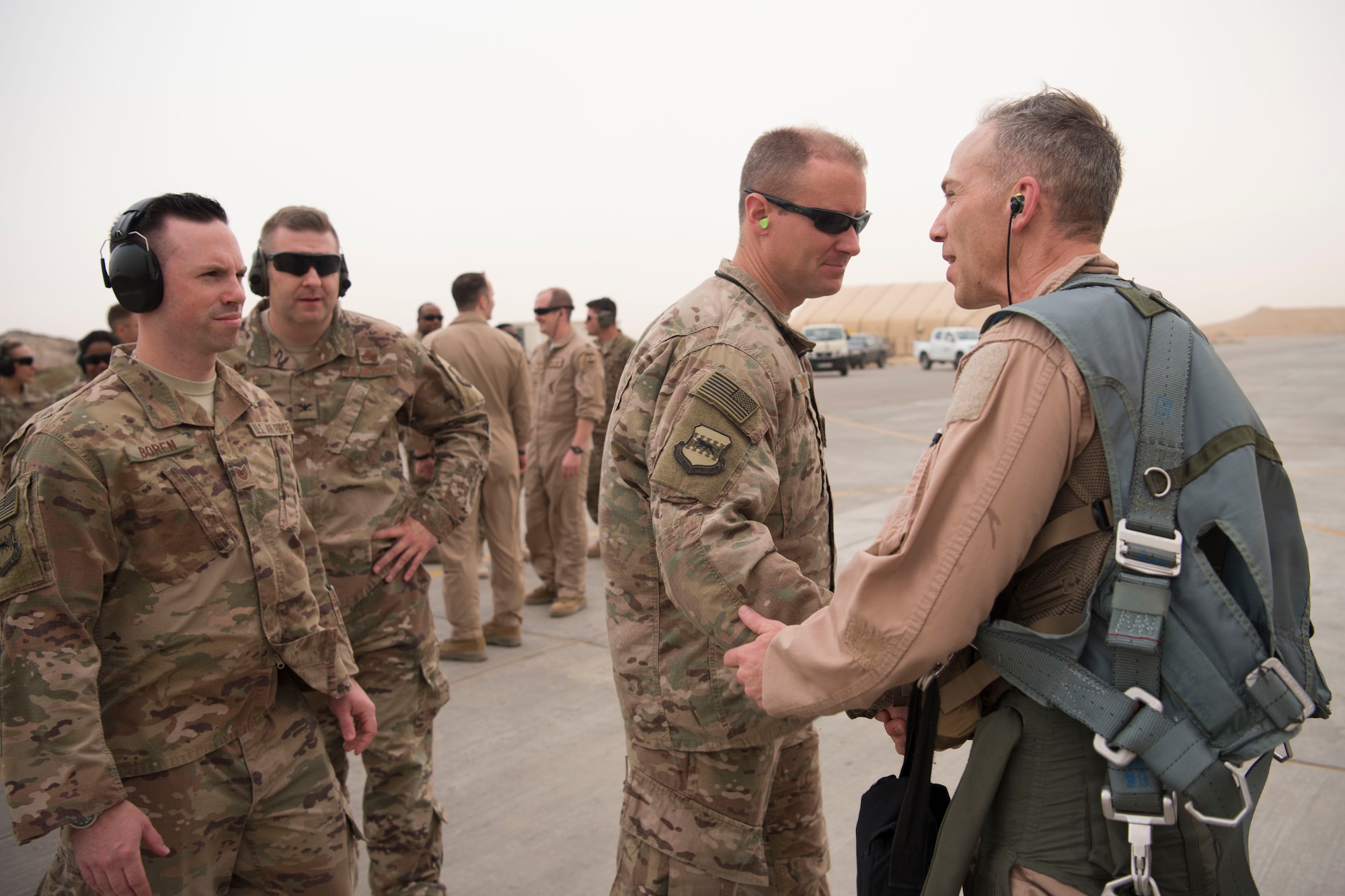 Airmen with the 332nd Air Expeditionary Wing congratulate Col. Shane Steinke, 332nd AEW vice commander, for completing his final flight May 7, 2018, at an undisclosed location in Southwest Asia.