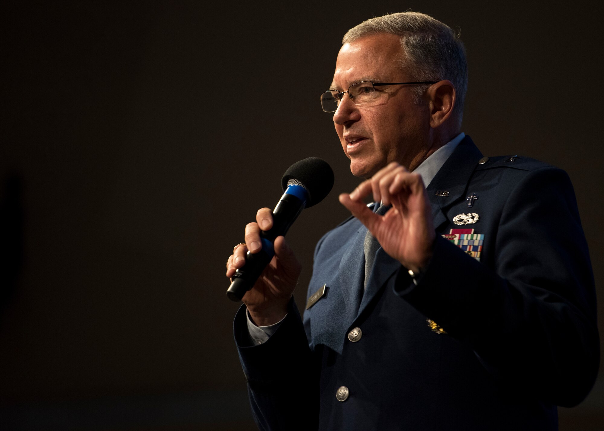 U.S. Air Force Chaplain (Brig. Gen.) Steven Schaick, deputy chief of chaplains, Headquarters U. S. Air Force, Pentagon, Washington, D.C., performs a prayer of unity during the 67th Annual National Day of Prayer observance at Kirtland Air Force Base, N.M., May 3.  In 1988, the law was amended and signed by President Reagan, permanently setting the day as the first Thursday of every May.(U.S. Air Force photo by Staff Sgt. J.D. Strong II)