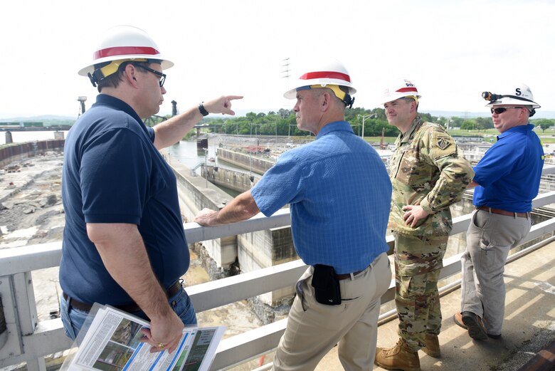 Tommy Long (Left), U.S. Army Corps of Engineers Nashville District’s resident engineer for the Chickamauga Lock Replacement Project, updates Vice Adm. Charles Ray (Second from Left), U.S. Coast Guard deputy commandant for Operations, on the ongoing excavation work to remove 100,000 cubic yards of rock from the riverbed. Lt. Col. Cullen Jones, Nashville District commander, and Daniel T. Moore, Tennessee Valley Authority Dam Safety civil engineer, also provided updates. Long explained that there have been about 130 blasts so far with about a third of the excavation work completed. Ray, the incoming assistant commandant of the Coast Guard, visited the lock at Tennessee River mile 471 in Chattanooga, Tenn., May 4, 2018. (USACE Photo by Lee Roberts)