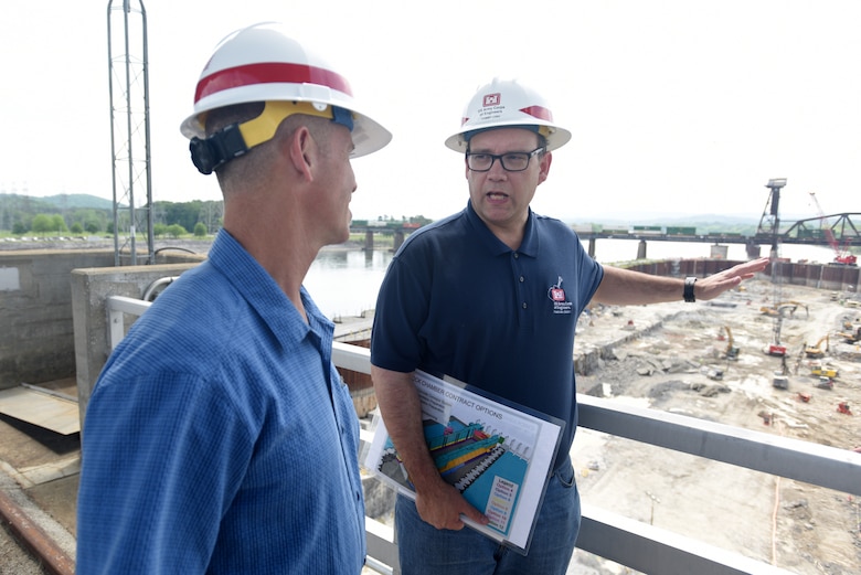 Tommy Long (Right), U.S. Army Corps of Engineers Nashville District’s resident engineer for the Chickamauga Lock Replacement Project, updates Vice Adm. Charles Ray, U.S. Coast Guard deputy commandant for Operations, on the ongoing excavation work to remove 100,000 cubic yards of rock from the riverbed. Long explained that there have been about 130 blasts so far with about a third of the excavation work completed. Ray, the incoming assistant commandant of the Coast Guard, visited the lock at Tennessee River mile 471 in Chattanooga, Tenn., May 4, 2018. (USACE Photo by Lee Roberts)