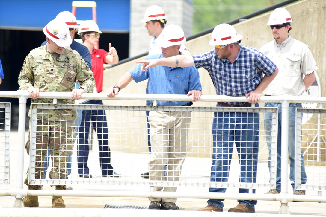 Cory Richardson (Right), lockmaster with the U.S. Army Corps of Engineers Nashville District, points toward the downstream gate as he leads Vice Adm. Charles Ray, U.S. Coast Guard deputy commandant for Operations, on a tour of Chickamauga Lock May 4, 2018 at Tennessee River mile 471 in Chattanooga, Tenn. Ray is the incoming assistant commandant of the Coast Guard. (USACE Photo by Lee Roberts)