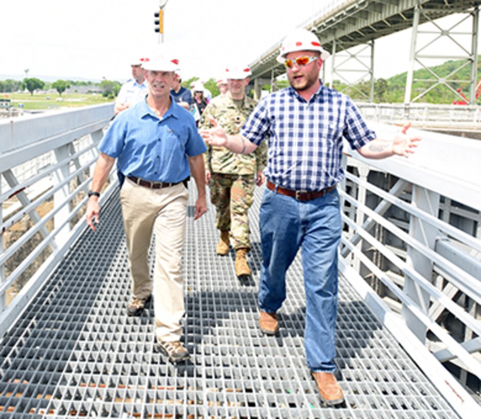 Cory Richardson (Right), lockmaster with the U.S. Army Corps of Engineers Nashville District, leads Vice Adm. Charles Ray, U.S. Coast Guard deputy commandant for Operations, on a tour of Chickamauga Lock May 4, 2018 at Tennessee River mile 471 in Chattanooga, Tenn. Ray is the incoming assistant commandant of the Coast Guard. (USACE Photo by Lee Roberts)