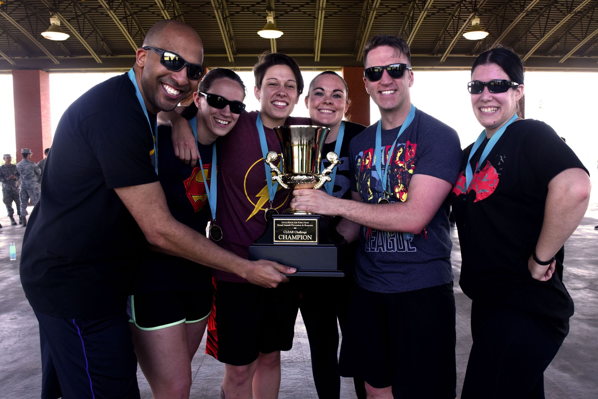 The 19th Airlift Wing’s legal office is holding their first place trophy after winning the CLEAR Challenge competition.