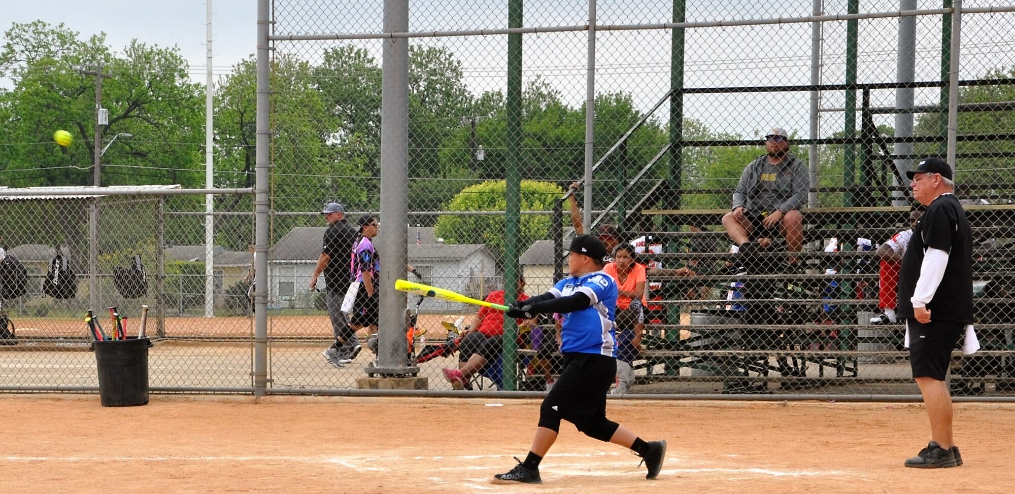 Tech. Sgt. Christina Rapolla swats it into right field during an April 21 Warhawks game. (U.S. Air Force photo by Debbie Gildea)