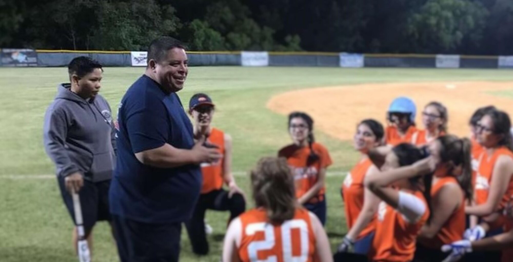Tech. Sgt. Christina Rapolla and co-coach R.J. encourage the team before a recent youth tournament. Supporting youth sports is one way Rapolla pays it forward in thanks for others’ help when her single-parent mom struggled to make ends meet and couldn’t afford sports costs. (Photo courtesy of Doreen Rapolla Duenas)