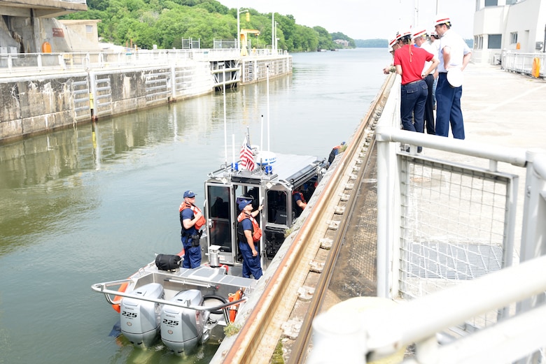 A response boat with the U.S. Coast Guard Sector Ohio Valley home stationed in Louisville, Ky., stops while navigating through Chickamauga Lock at Tennessee River mile 471 to pay their respects to Vice Adm. Charles Ray during his tour of the Tennessee Valley Authority project May 4, 2018 in Chattanooga, Tenn. The U.S. Army Corps of Engineers Nashville District operates and maintains the lock. Ray is the incoming assistant commandant of the Coast Guard. (USACE Photo by Lee Roberts)