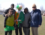 Members of DLA Troop Support Medical’s operational customer facing division pose for a photo before a 5K run and walk for St. Patrick’s Day at Naval Support Activity Philadelphia, March 15, 2018.