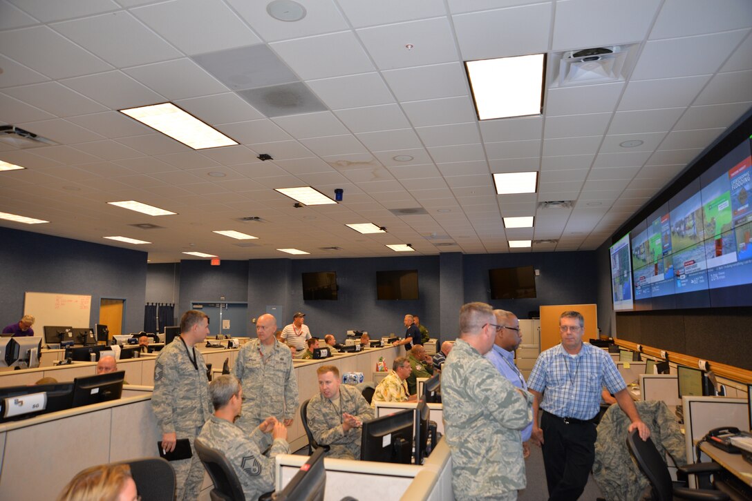 Air Forces Northern crisis action team members discuss hurricane-response options during Hurricane Harvey operations in 2017. (Air Force photo by Mary McHale)