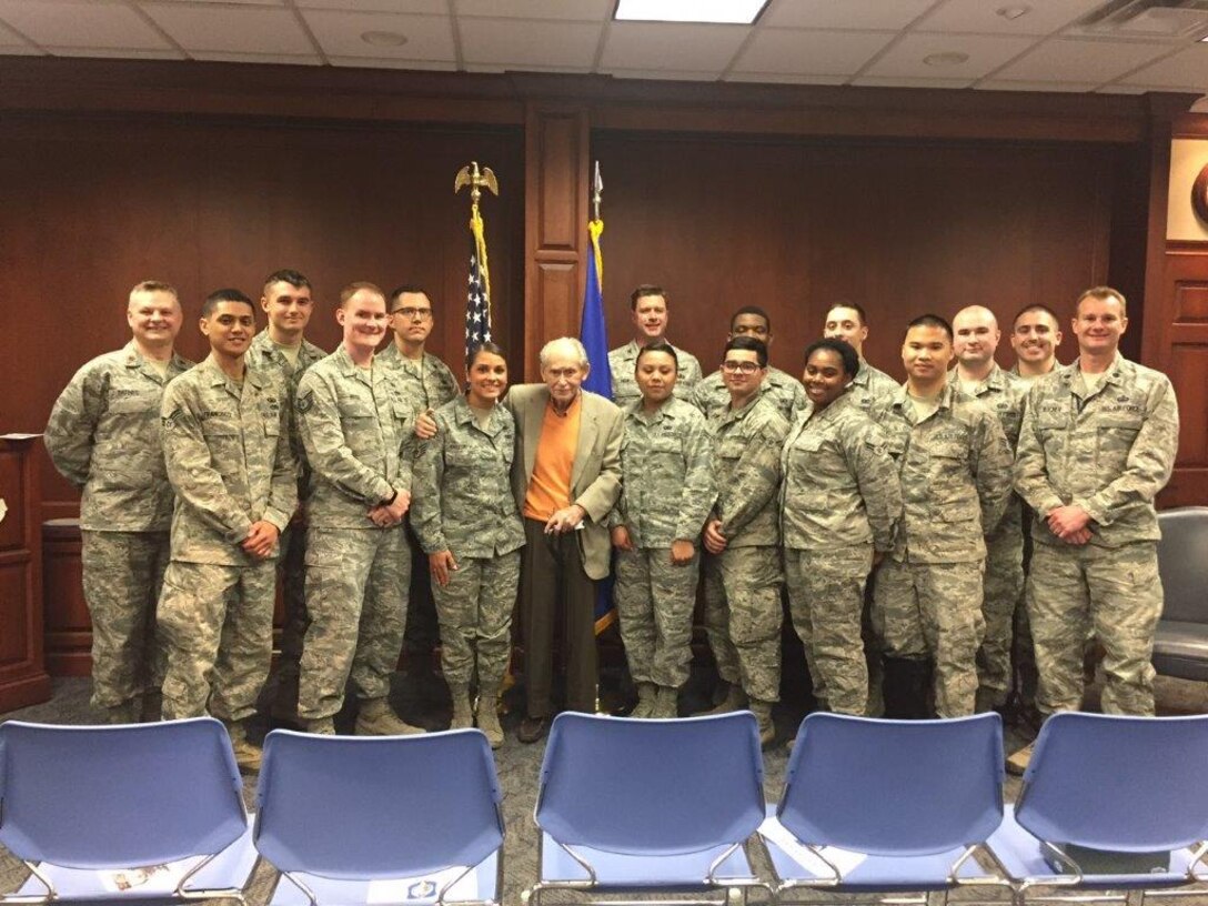 Members of the Business and Enterprise Systems Directorate pose April 30 with Samuel Heider, a Holocaust survivor who has lived much of his life in Dayton, on the 73rd anniversary of his liberation by American forces in Germany. (Photo by Amy Rollins)