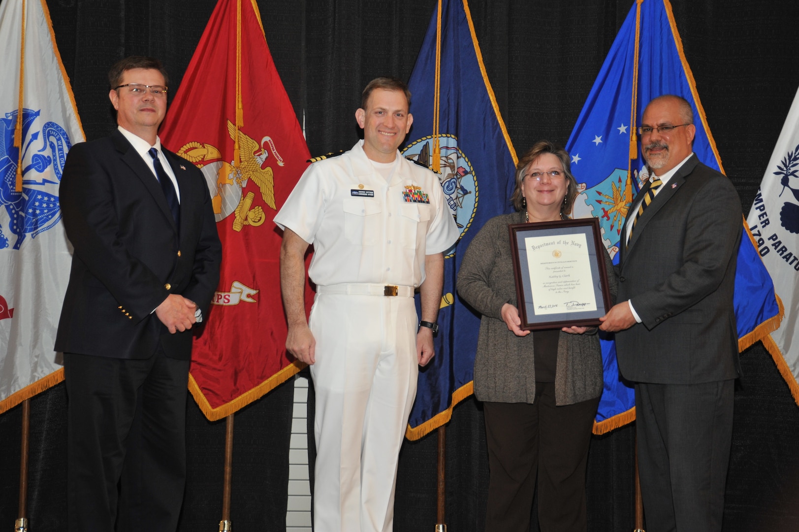 IMAGE: Kathy Clark is presented the Navy Meritorious Civilian Service Award at Naval Surface Warfare Center Dahlgren Division's annual awards ceremony, Apr. 26 at the Fredericksburg Expo and Conference Center.