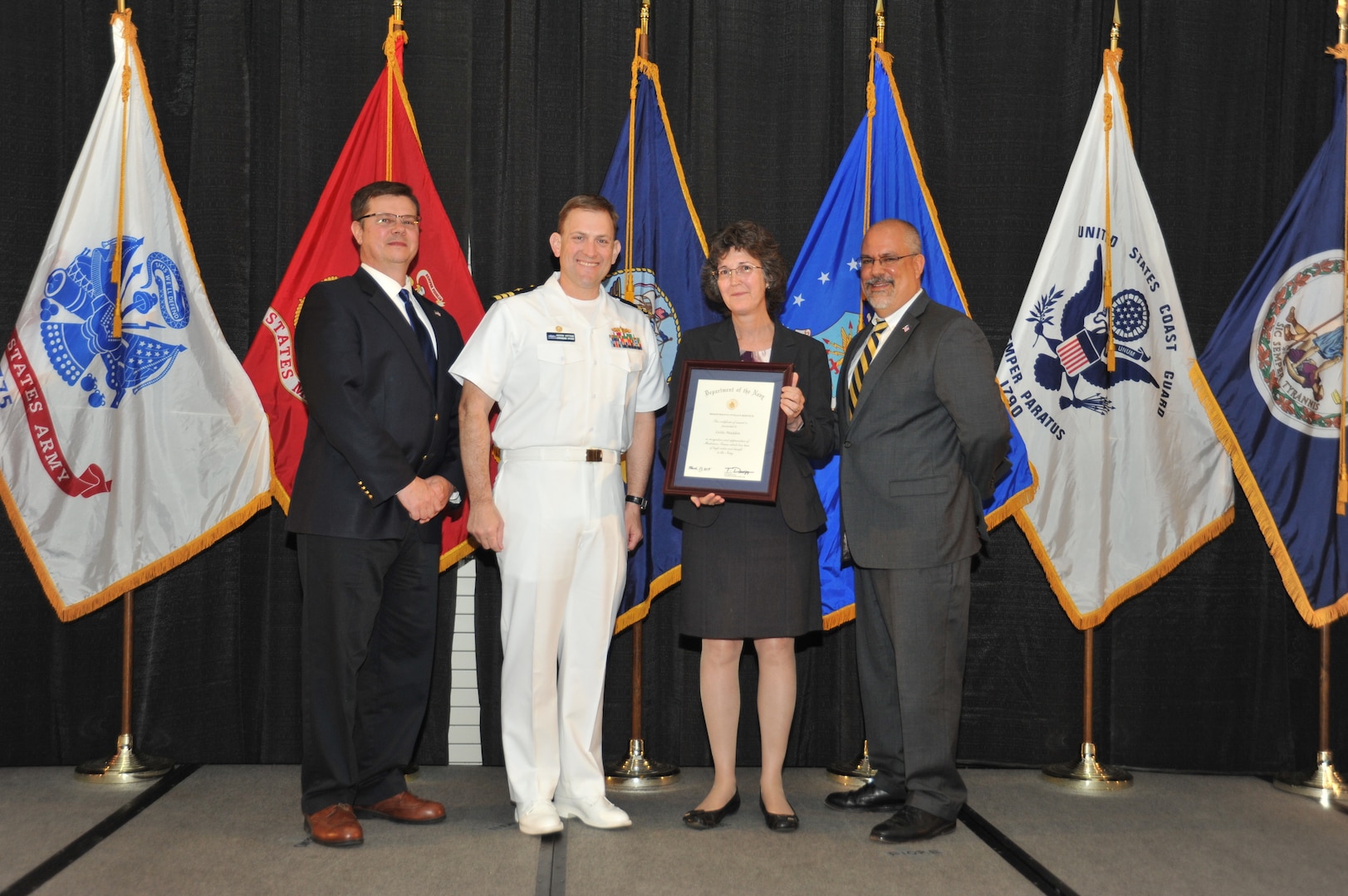 IMAGE: Leslie Madden is presented the Navy Meritorious Civilian Service Award at Naval Surface Warfare Center Dahlgren Division's annual awards ceremony, Apr. 26 at the Fredericksburg Expo and Conference Center.