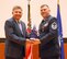 655th Intelligence, Surveillance and Reconnaissance Chief Master Sgt.David L. Wright (left) presents Unit Training Manager and Unit Deployment Manager Master Sgt. Todd Cook a gift from the unit at his retirement ceremony, here, April 21, 2018. Cook retired after 23 years of service. (U.S. Air Force photo/2nd Lt. Weston Woodward)