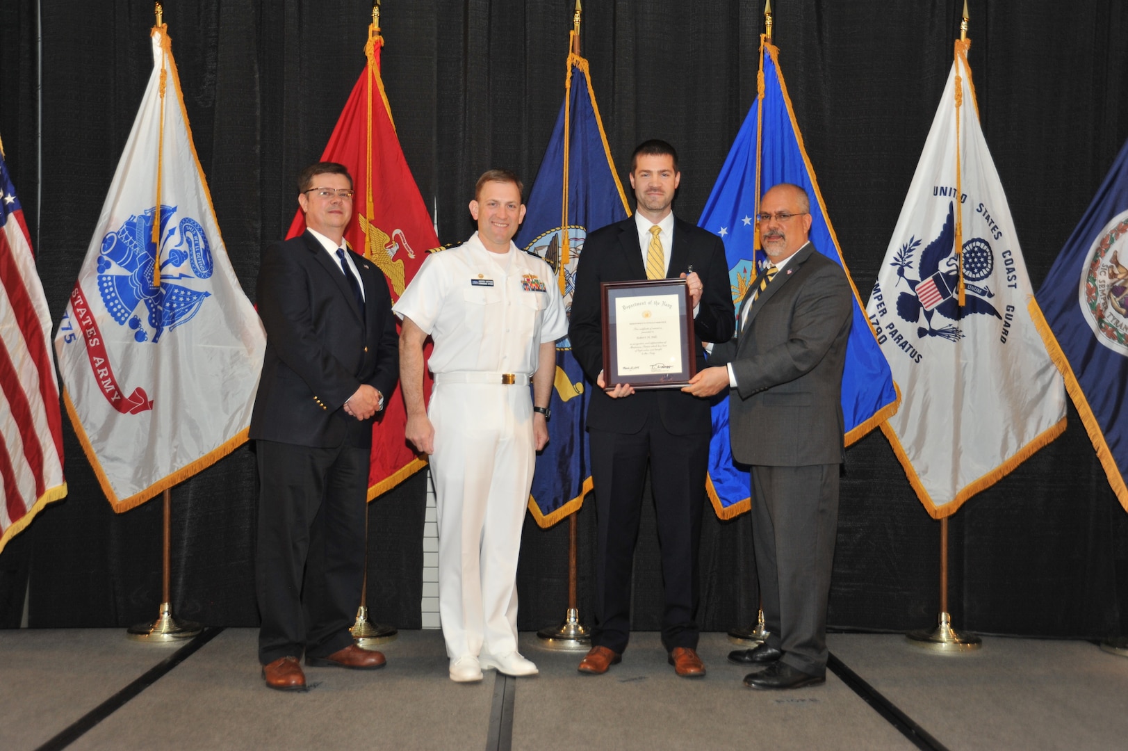 IMAGE: Robert Bills is presented the Navy Meritorious Civilian Service Award at Naval Surface Warfare Center Dahlgren Division's annual awards ceremony, Apr. 26 at the Fredericksburg Expo and Conference Center.