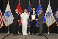 IMAGE: Robert Bills is presented the Navy Meritorious Civilian Service Award at Naval Surface Warfare Center Dahlgren Division's annual awards ceremony, Apr. 26 at the Fredericksburg Expo and Conference Center.