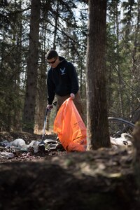 Airman Leadership School students help clean up Davis Park in Anchorage Alaska, May 5, 2018. This event emphasized the importance of keeping local areas clean and building relationships with the community.