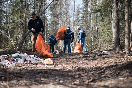 Airman Leadership School students help clean up Davis Park in Anchorage Alaska, May 5, 2018. This event emphasized the importance of keeping local areas clean and building relationships with the community.