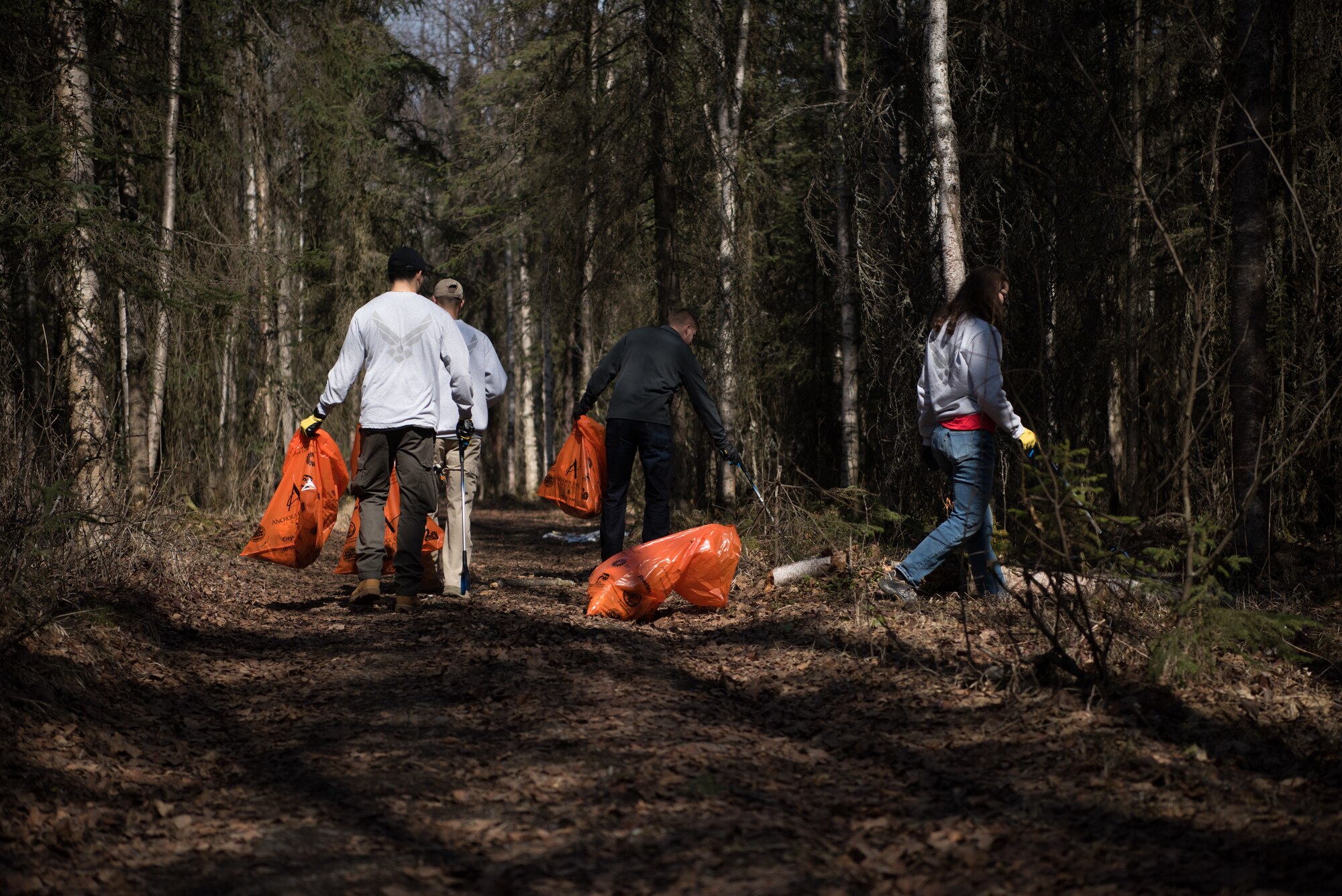 Airman Leadership School students help clean up Davis Park in Anchorage Alaska, May 5, 2018. This event emphasized the importance of keeping local areas clean and building relationships with the community.