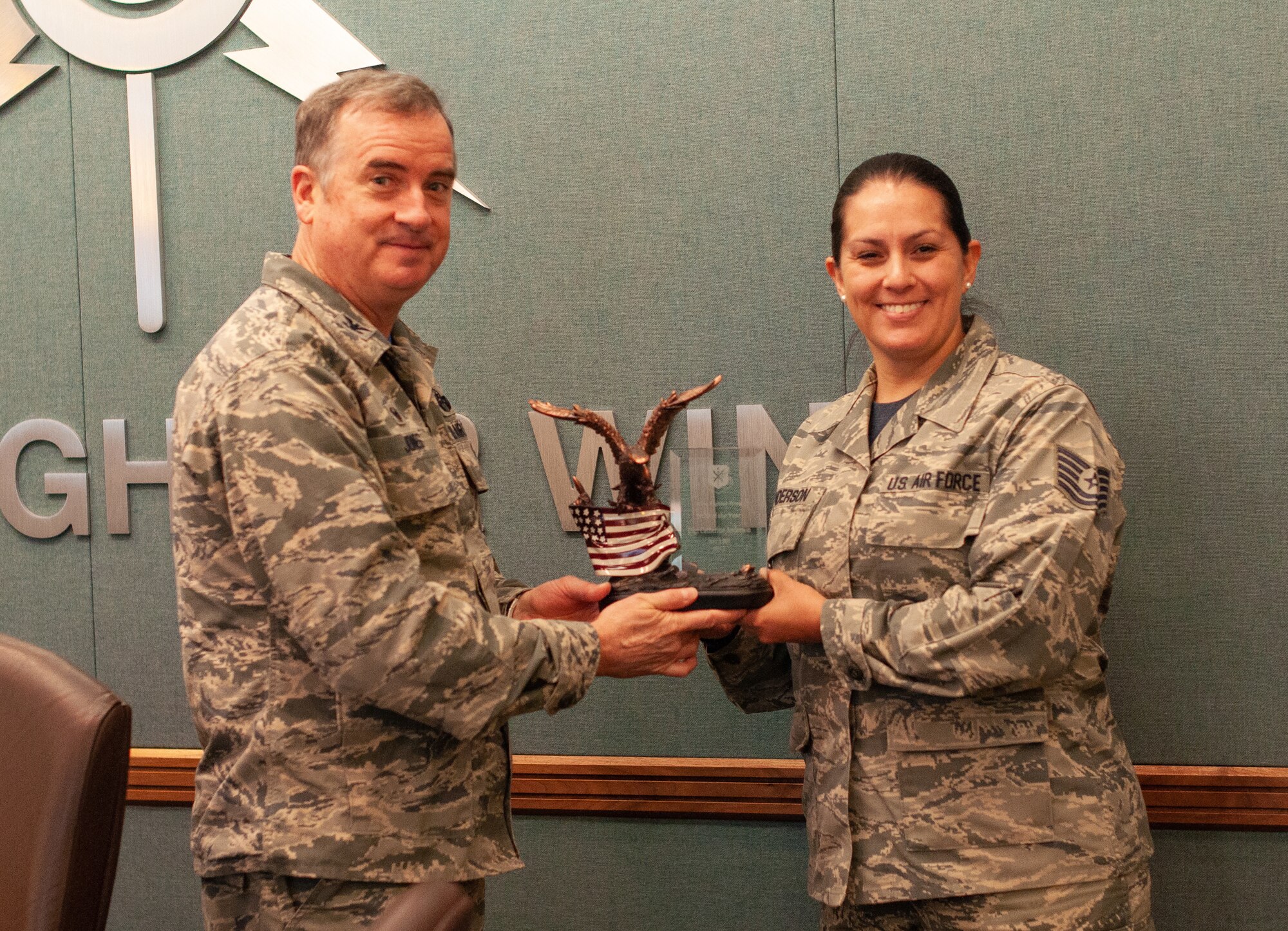 Col. Gregory Jones, 301st Fighter Wing commander, presents Tech. Sgt. Catherine Anderson, a vehicle operator assigned to the 301st Logistics Readiness Squadron, with the wing’s Non-Commissioned Officer of the Year before senior leadership May 6, 2018 at Naval Air Station Fort Worth Joint Reserve Base, Texas. The wing’s annual award winners are among the best of the best and standout examples of Reserve Citizen Airmen. (U.S. Air Force photo by Master Sgt. Joshua Woods)