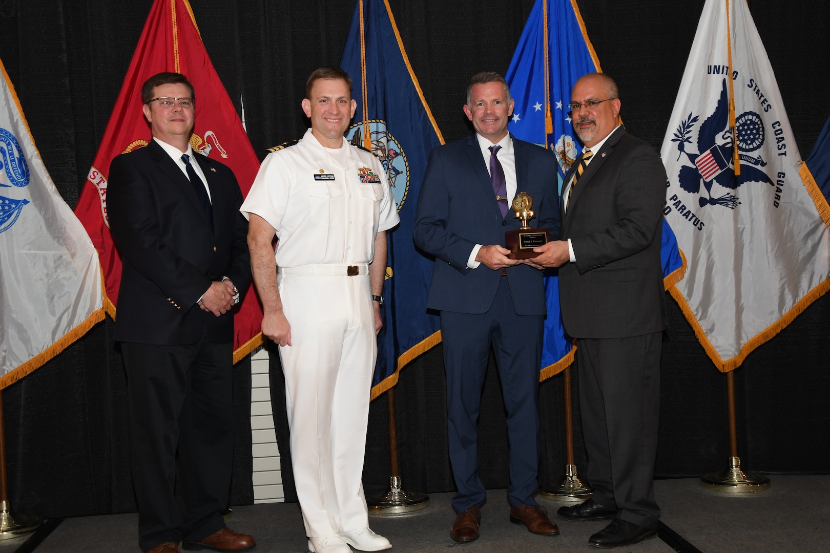 IMAGE: Patrick Freemyers is presented the Dr. James Colvard Award at Naval Surface Warfare Center Dahlgren Division's annual awards ceremony, Apr. 26 at the Fredericksburg Expo and Conference Center.