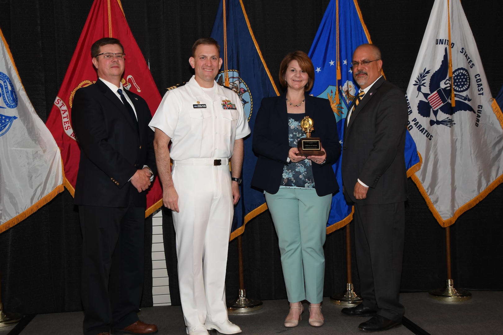 IMAGE: Catherine Borisuk is presented the Dr. James Colvard Award at Naval Surface Warfare Center Dahlgren Division's annual awards ceremony, Apr. 26 at the Fredericksburg Expo and Conference Center.