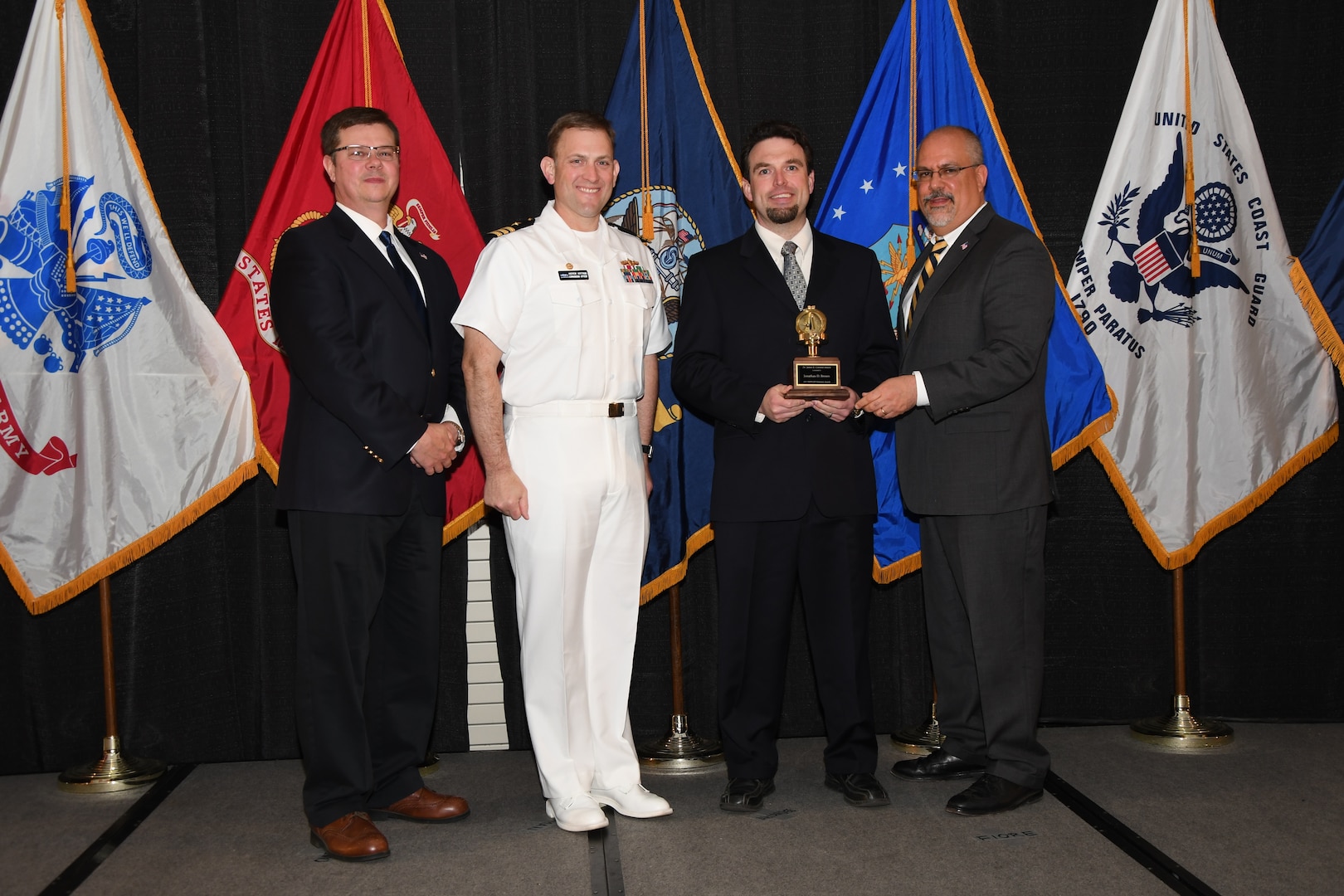 IMAGE: Jonathan Brown is presented the Dr. James Colvard Award at Naval Surface Warfare Center Dahlgren Division's annual awards ceremony, Apr. 26 at the Fredericksburg Expo and Conference Center.