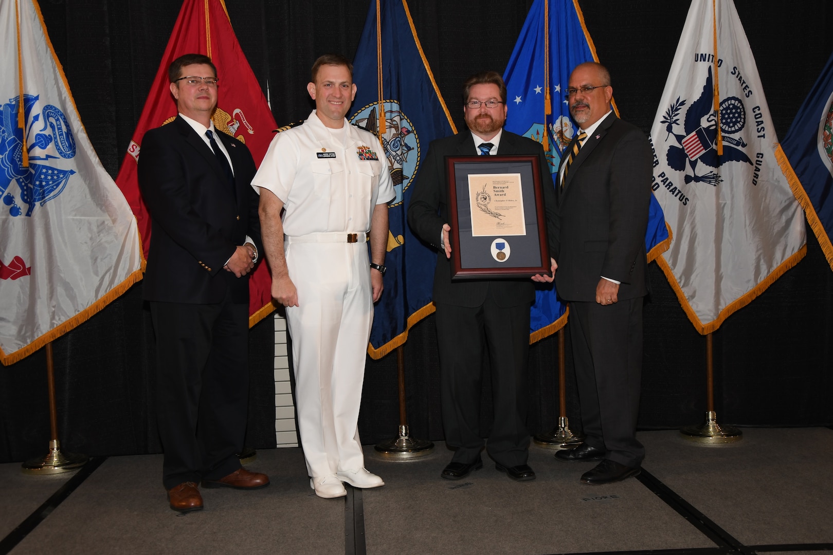 IMAGE:Christopher Behre is presented the Bernard Smith Award at Naval Surface Warfare Center Dahlgren Division's annual awards ceremony, Apr. 26 at the Fredericksburg Expo and Conference Center.
