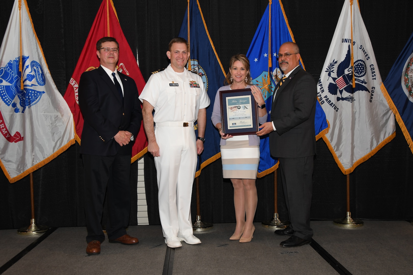 IMAGE: Angela Bowling is presented the Helen Springer Award at Naval Surface Warfare Center Dahlgren Division's annual awards ceremony, Apr. 26 at the Fredericksburg Expo and Conference Center.

The award recognizes individuals who have made a notable and significant impact to business operations at NSWCDD. The award was named in honor of Helen Springer, a former NSWCDD Deputy Human Resources Director who was instrumental in transforming business operations at Dahlgren from a paper-based system to an electronic environment.