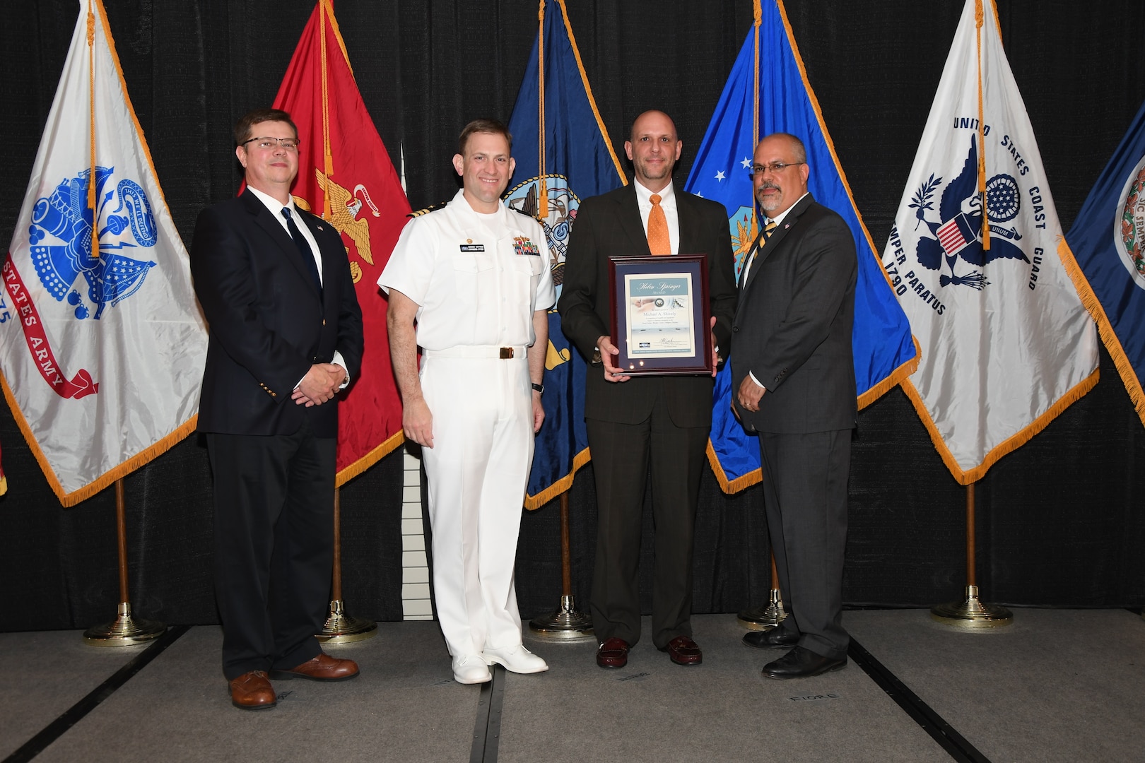 IMAGE: Michael Shively is presented the Helen Springer Award at Naval Surface Warfare Center Dahlgren Division's annual awards ceremony, Apr. 26 at the Fredericksburg Expo and Conference Center.

The award recognizes individuals who have made a notable and significant impact to business operations at NSWCDD. The award was named in honor of Helen Springer, a former NSWCDD Deputy Human Resources Director who was instrumental in transforming business operations at Dahlgren from a paper-based system to an electronic environment.