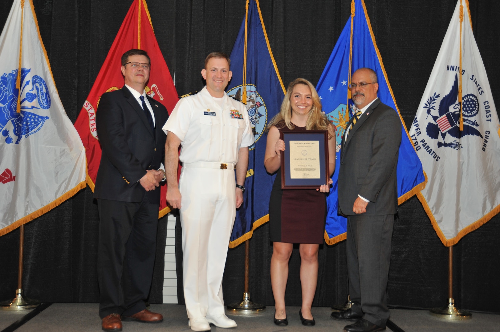 IMAGE: Courtney Sloat is presented the Leadership Award at Naval Surface Warfare Center Dahlgren Division's annual awards ceremony, Apr. 26 at the Fredericksburg Expo and Conference Center.