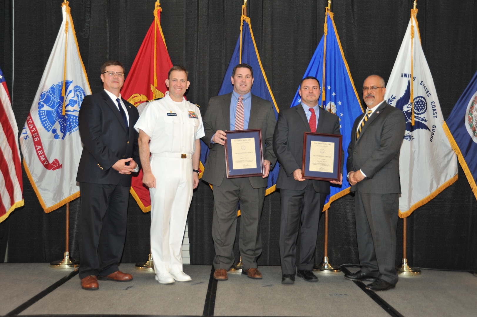 IMAGE: Edwin Regan and Todd Graves are presented the Leadership Award at Naval Surface Warfare Center Dahlgren Division's annual awards ceremony, Apr. 26 at the Fredericksburg Expo and Conference Center.