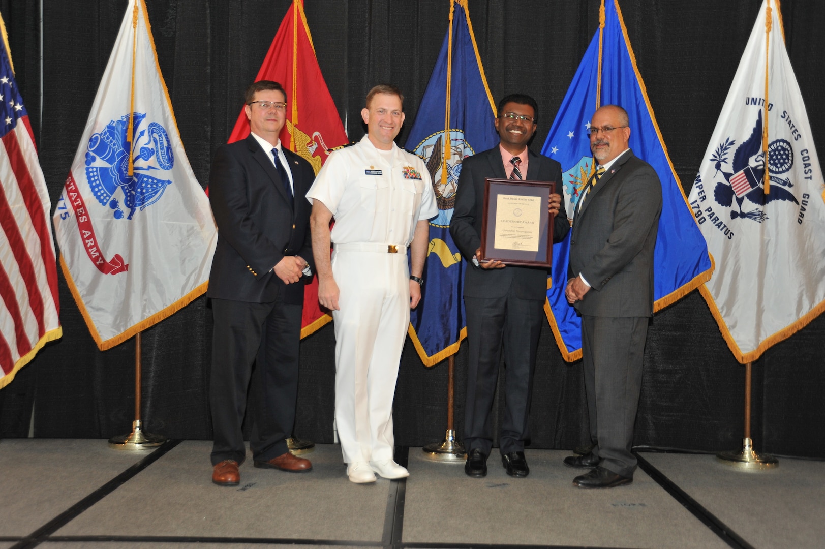 IMAGE: Gunendran Sivapragasam  is presented the Leadership Award at Naval Surface Warfare Center Dahlgren Division's annual awards ceremony, Apr. 26 at the Fredericksburg Expo and Conference Center.