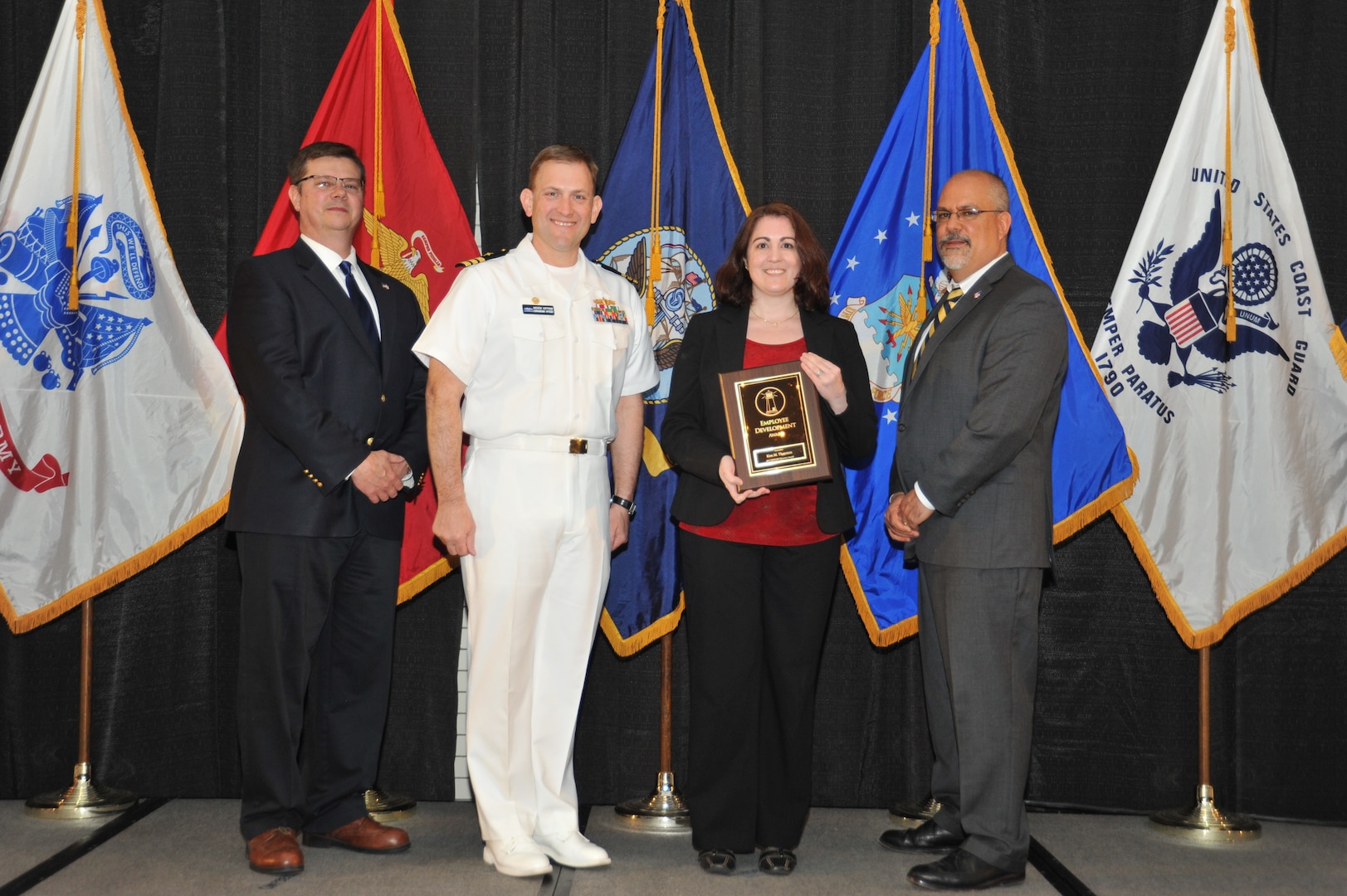 IMAGE:Kim Thorton is presented the Employee Development Award at Naval Surface Warfare Center Dahlgren Division's annual awards ceremony, Apr. 26 at the Fredericksburg Expo and Conference Center.

The Employee Development Award was established to recognize those individuals who – through their leadership and commitment – have made exemplary contributions to the development of others.
