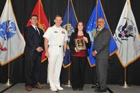 IMAGE:Kim Thorton is presented the Employee Development Award at Naval Surface Warfare Center Dahlgren Division's annual awards ceremony, Apr. 26 at the Fredericksburg Expo and Conference Center.

The Employee Development Award was established to recognize those individuals who – through their leadership and commitment – have made exemplary contributions to the development of others.