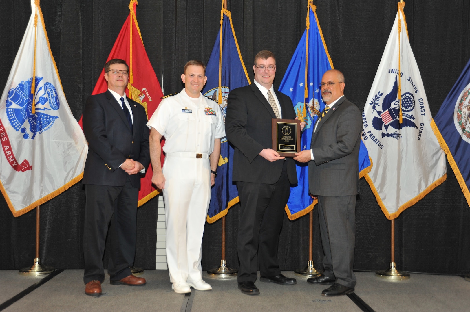 IMAGE: Kevin Cogley is presented the Employee Development Award at Naval Surface Warfare Center Dahlgren Division's annual awards ceremony, Apr. 26 at the Fredericksburg Expo and Conference Center.

The Employee Development Award was established to recognize those individuals who – through their leadership and commitment – have made exemplary contributions to the development of others.
