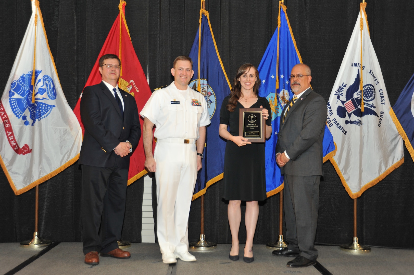 IMAGE: Allison Mead is presented the Employee Development Award at Naval Surface Warfare Center Dahlgren Division's annual awards ceremony, Apr. 26 at the Fredericksburg Expo and Conference Center.

The Employee Development Award was established to recognize those individuals who – through their leadership and commitment – have made exemplary contributions to the development of others.