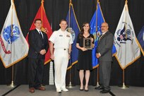 IMAGE: Allison Mead is presented the Employee Development Award at Naval Surface Warfare Center Dahlgren Division's annual awards ceremony, Apr. 26 at the Fredericksburg Expo and Conference Center.

The Employee Development Award was established to recognize those individuals who – through their leadership and commitment – have made exemplary contributions to the development of others.