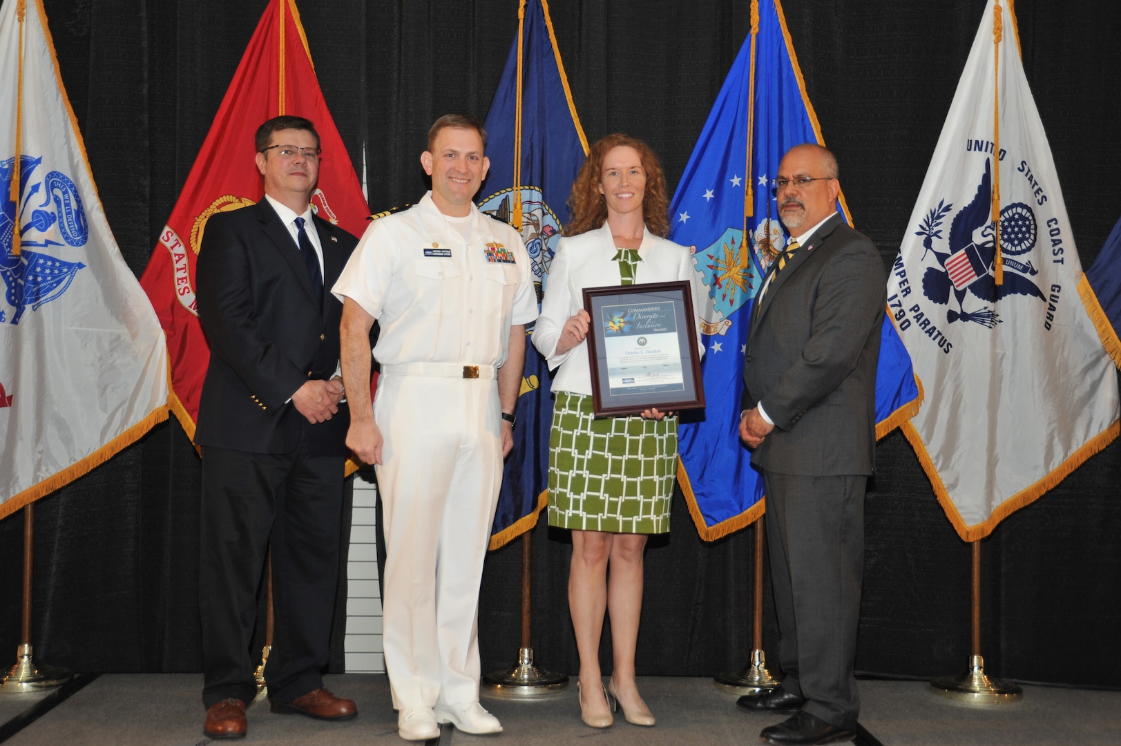 IMAGE: Debbie Bardine is presented the Commander's Diversity and Inclusion Award at Naval Surface Warfare Center Dahlgren Division's annual awards ceremony, Apr. 26 at the Fredericksburg Expo and Conference Center.