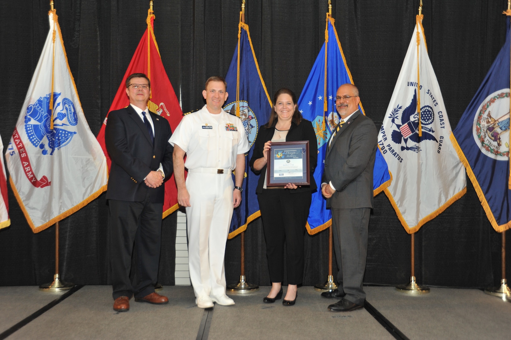 IMAGE: Shellie Clift is presented the Commander's Diversity and Inclusion Award at Naval Surface Warfare Center Dahlgren Division's annual awards ceremony, Apr. 26 at the Fredericksburg Expo and Conference Center.