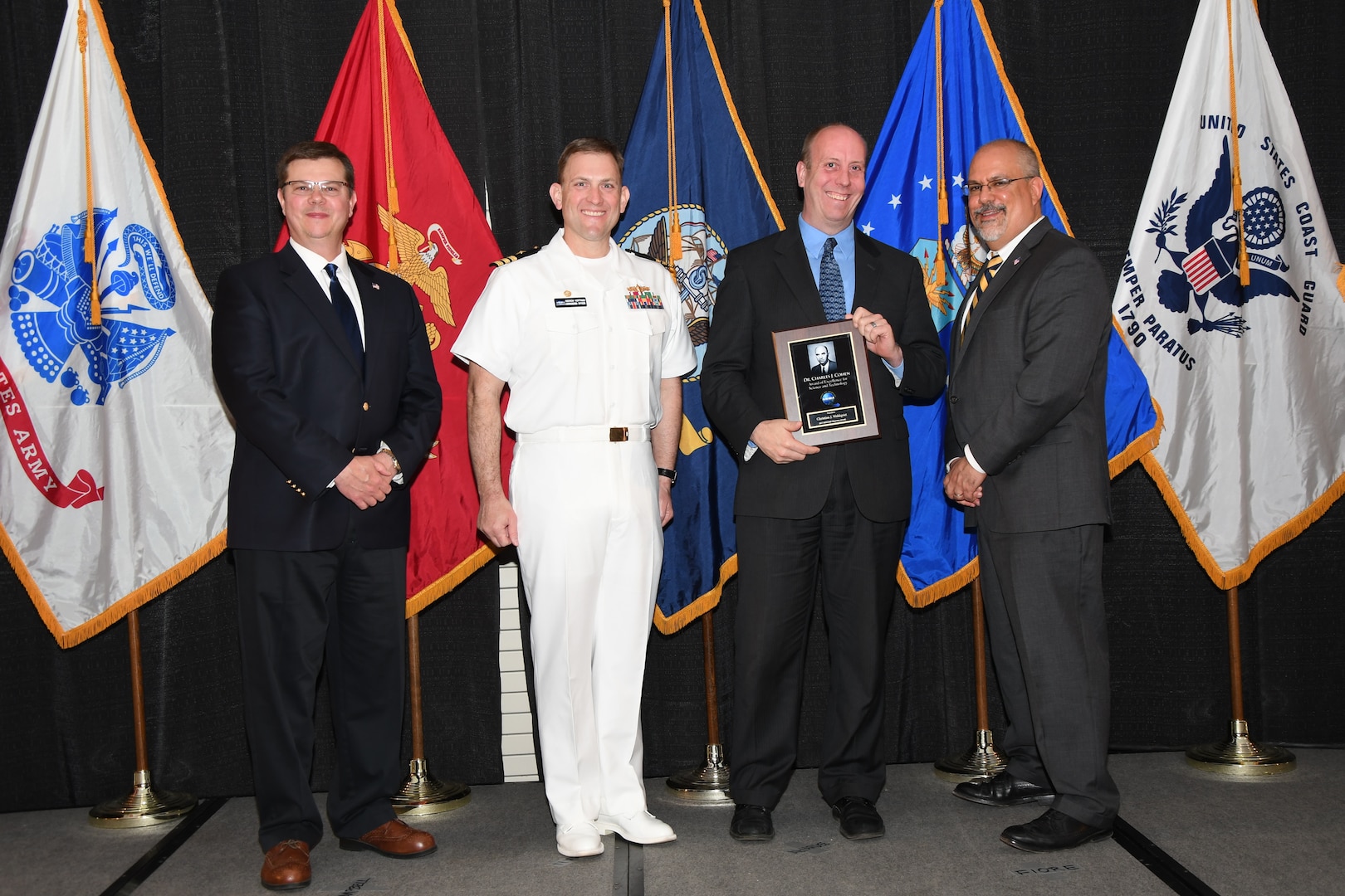 IMAGE: Christian Wahlquist is presented the Dr. Charles J. Cohen Award at Naval Surface Warfare Center Dahlgren Division's annual awards ceremony, Apr. 26 at the Fredericksburg Expo and Conference Center.

The award recognizes those who fundamentally impact science or technology with work that also measurably impacts capability.
