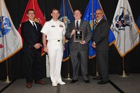 IMAGE: William Moore is presented the Dr. Charles J. Cohen Award at Naval Surface Warfare Center Dahlgren Division's annual awards ceremony, Apr. 26 at the Fredericksburg Expo and Conference Center.

The award recognizes those who fundamentally impact science or technology with work that also measurably impacts capability.