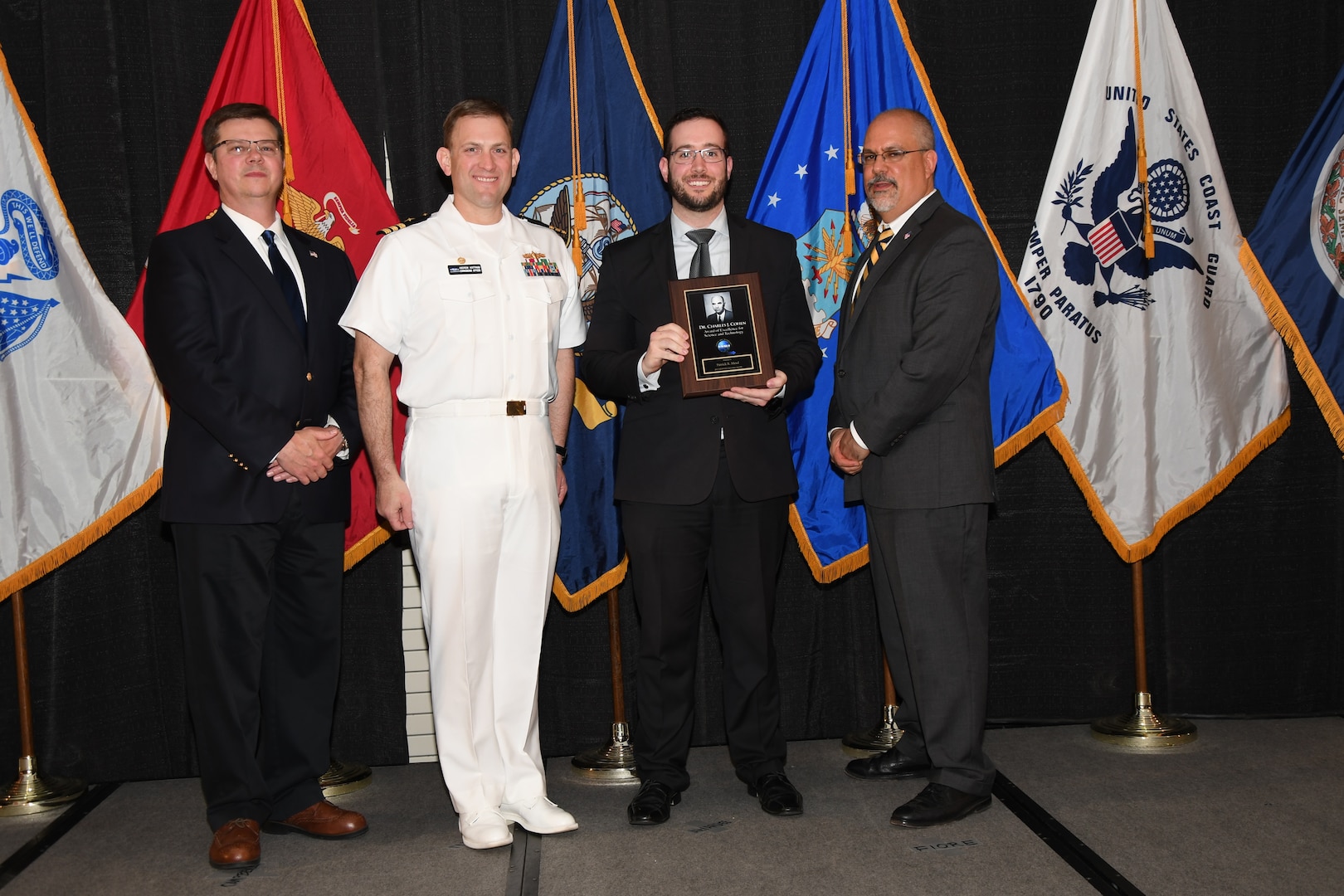 IMAGE: Patrick Mead is presented the Dr. Charles J. Cohen Award at Naval Surface Warfare Center Dahlgren Division's annual awards ceremony, Apr. 26 at the Fredericksburg Expo and Conference Center.

The award recognizes those who fundamentally impact science or technology with work that also measurably impacts capability.